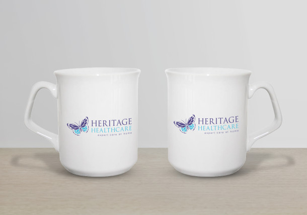 White Sparta ceramic mug with Heritage Healthcare logo